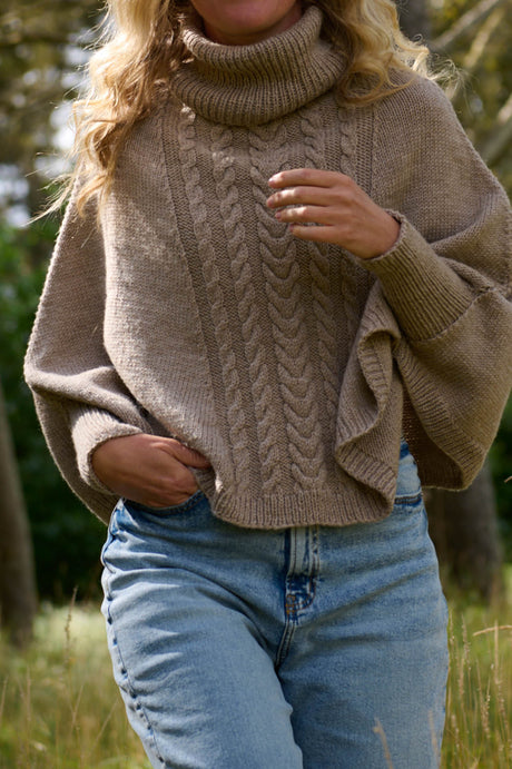 Poncho med ärmar